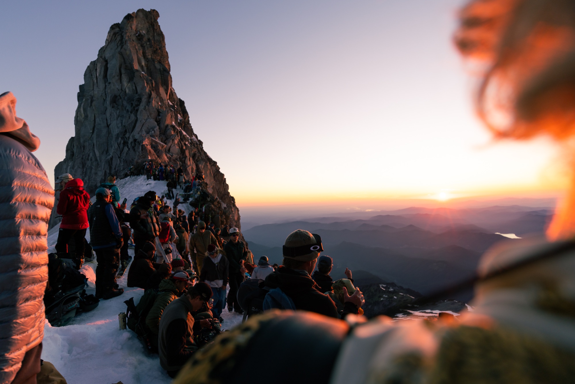 Skiers gathered at Illumination Saddle at sunset