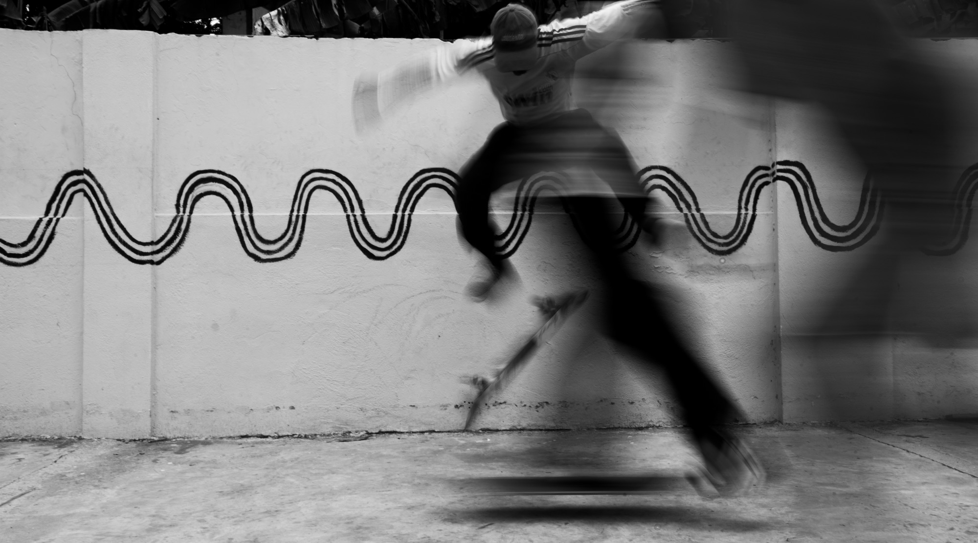 A skater in motion at the Vibrate Skatehouse courtyard